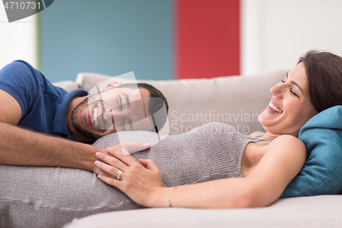 Image of future dad listening the belly of his pregnant wife