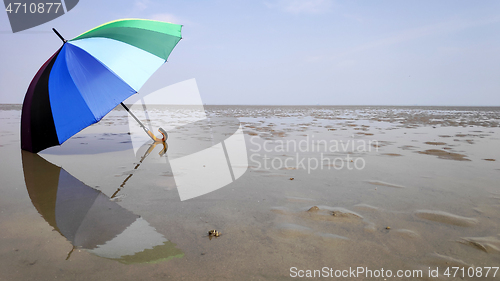 Image of Colorful umbrella and reflection 