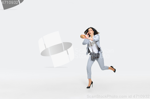 Image of Young woman comes late for work