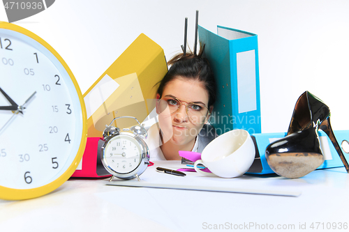 Image of Young woman getting a lot of work and deadline
