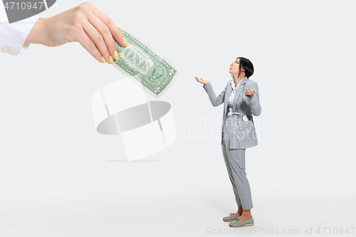 Image of Young woman getting a small salary