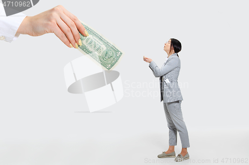 Image of Young woman getting a small salary