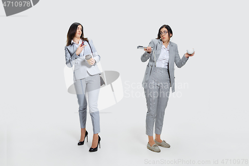 Image of Young woman comes to work rumpled and untidy