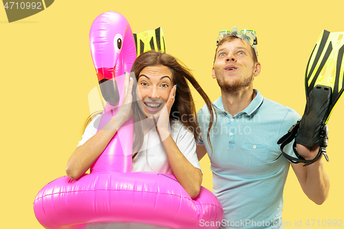 Image of Beautiful couple isolated on yellow studio background