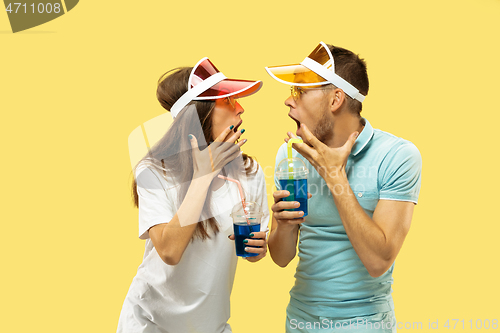 Image of Beautiful couple isolated on yellow studio background