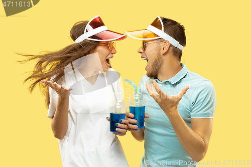 Image of Beautiful couple isolated on yellow studio background