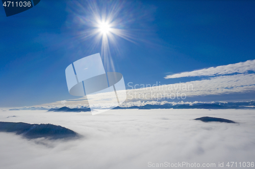 Image of Sunny day with low clouds