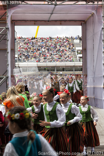 Image of Dancers behind scene waiting for time to perform at the Grand Folk dance concert