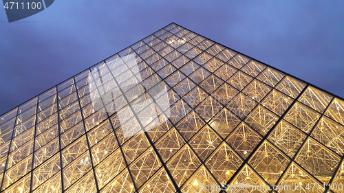 Image of View of famous Louvre Pyramid at evening