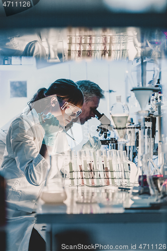 Image of Health care researchers working in scientific laboratory.