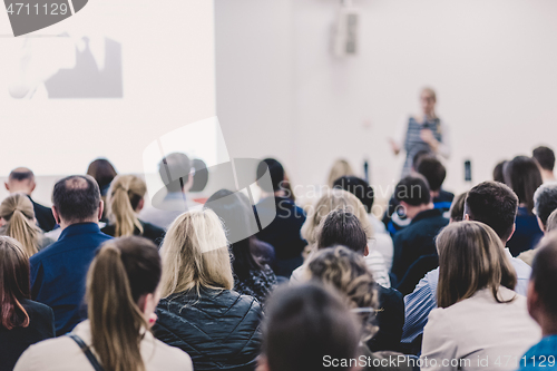 Image of Woman giving presentation on business conference.