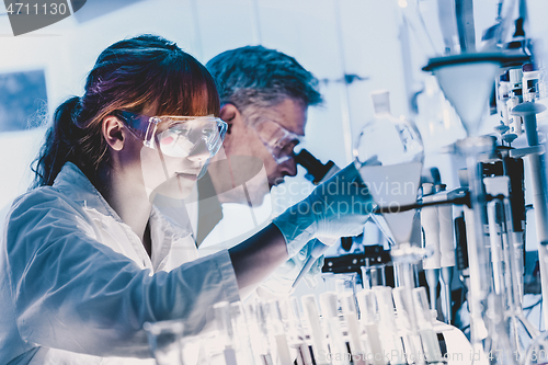 Image of Health care researchers working in scientific laboratory.