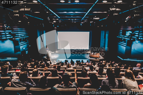 Image of DEFOCUSED image of speaker giving a talk in conference hall at business event.