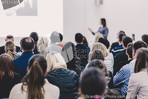 Image of Woman giving presentation on business conference.