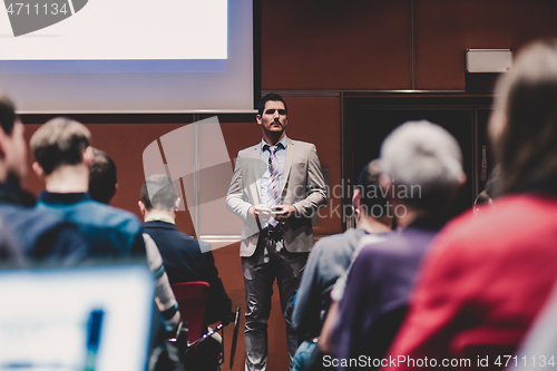 Image of Speaker Giving a Talk at Business Meeting.