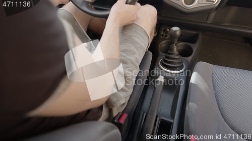 Image of Switching gearshift while driving car