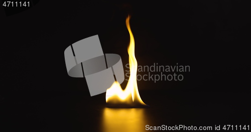 Image of Fire dancing against dark background 120fps slow motion loopable footage