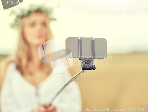 Image of close up of woman taking selfie by smartphone
