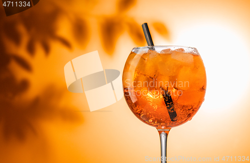 Image of glass of orange cocktail