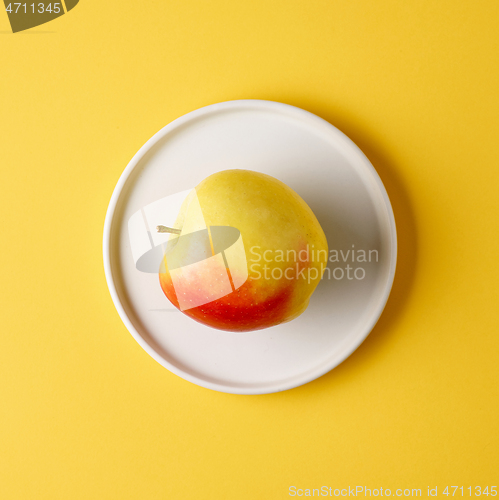 Image of apple on white plate