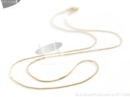 Image of gold chain on white background