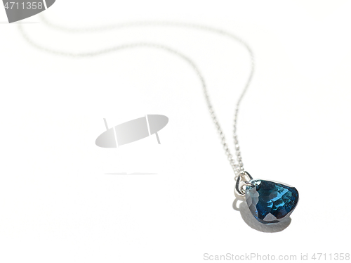 Image of silver chain with blue gemstone