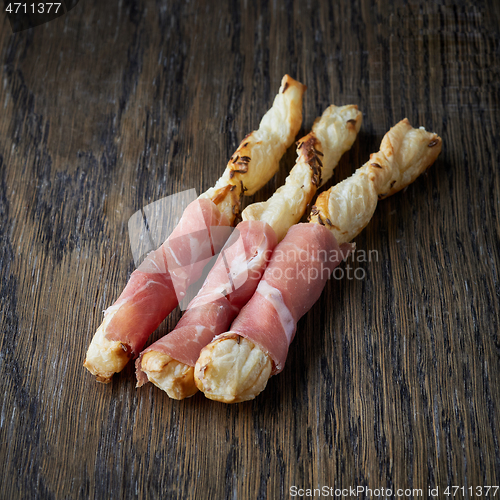 Image of bread sticks with prosciutto