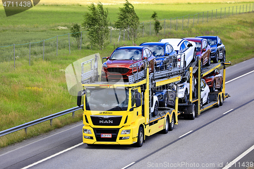 Image of Yellow MAN TGS Car Carrier Hauls New Cars 