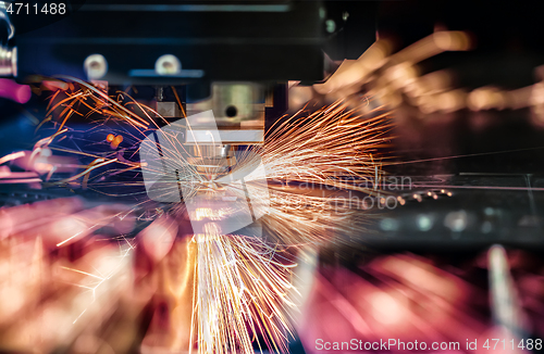 Image of CNC Laser cutting of metal, modern industrial technology.