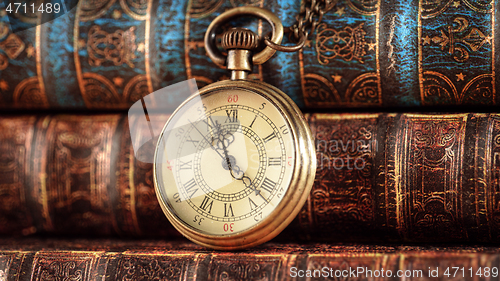 Image of Vintage pocket watch. Vintage background Concept of time history