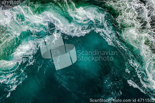 Image of Waves of water of the river and the sea meet each