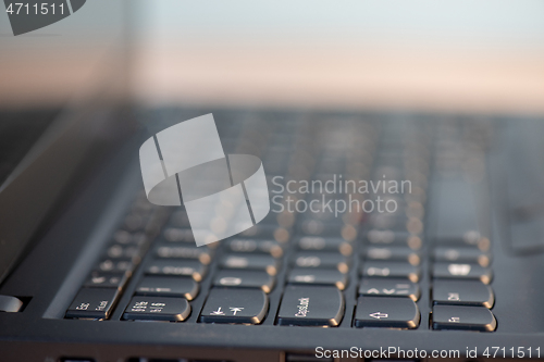 Image of Macro shot of laptop with black keyboard