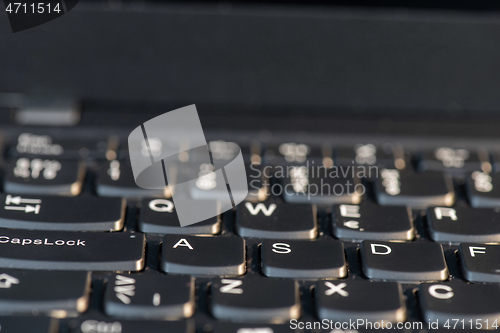 Image of Macro shot of laptop with black keyboard