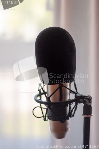 Image of Close up of microphone in studio room, blur background