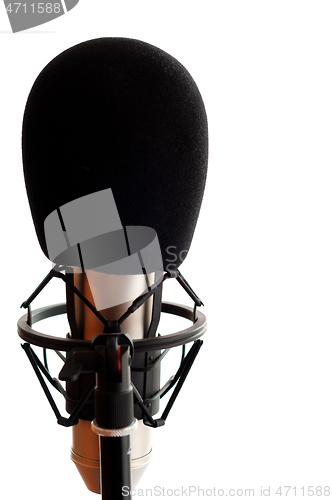Image of Close up of microphone in studio room, isolated on white