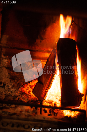 Image of Fireplace burning wood logs, cozy warm home time