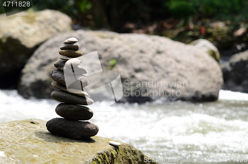 Image of Stacked zen stone at Tegenungan Waterfall