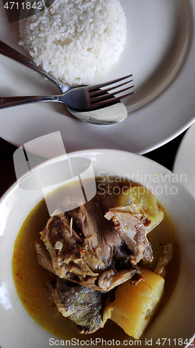 Image of Fish head soup served in street shop 