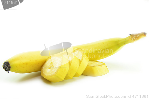 Image of Ripe yellow banana with sliced bananas