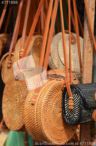 Image of Balinese handmade rattan eco bags in a local souvenir market in 