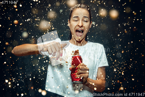 Image of Woman drinking a cola