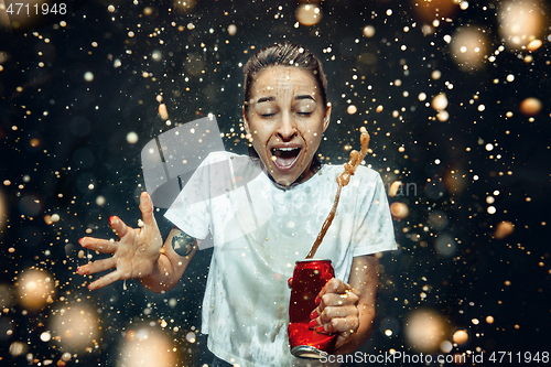 Image of Woman drinking a cola