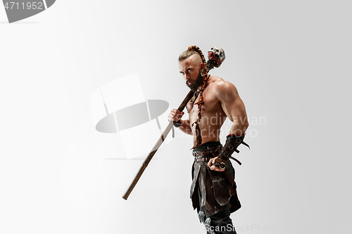 Image of Man in leather viking\'s costume isolated on white studio background