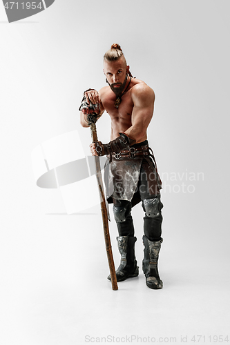 Image of Man in leather viking\'s costume isolated on white studio background