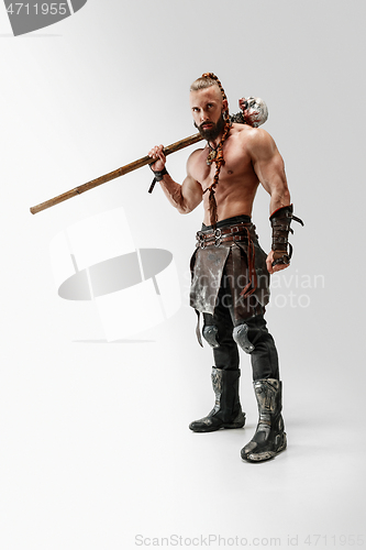 Image of Man in leather viking\'s costume isolated on white studio background