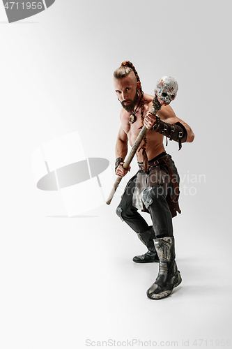 Image of Man in leather viking\'s costume isolated on white studio background