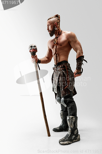 Image of Man in leather viking\'s costume isolated on white studio background
