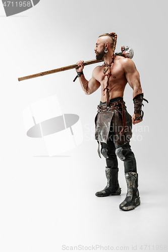 Image of Man in leather viking\'s costume isolated on white studio background