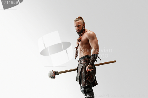 Image of Man in leather viking\'s costume isolated on white studio background