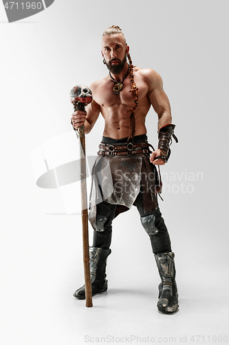 Image of Man in leather viking\'s costume isolated on white studio background